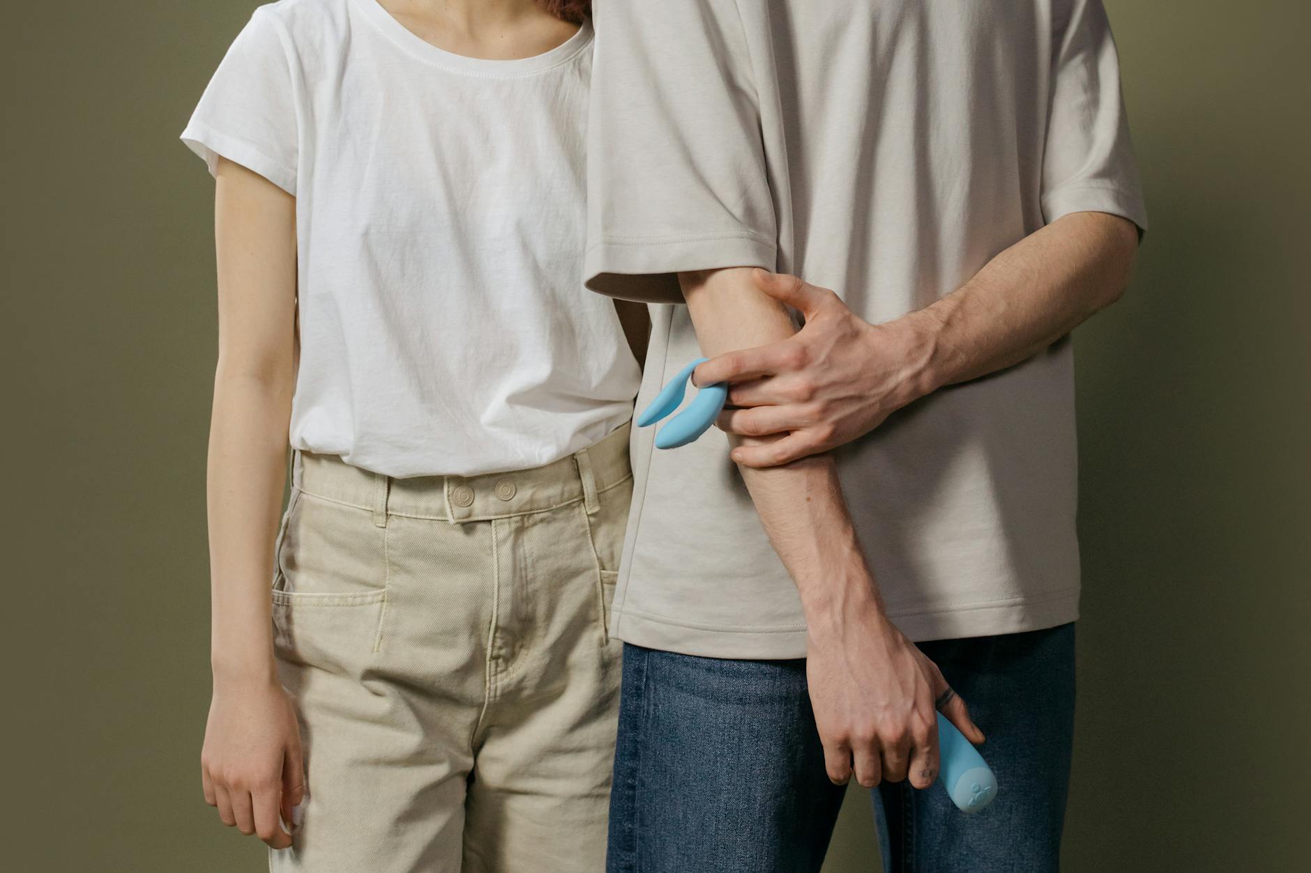 A couple together exploring intimacy and pleasure with a modern vibrator during recovery